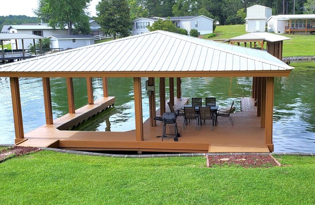 Point Windy Lakefront Property with boathouse, screened porch and fire pit.