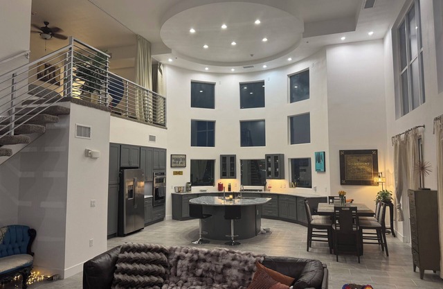 Incredible 2 level loft with 30ft ceilings -expansive balcony with STRIP VIEWS!