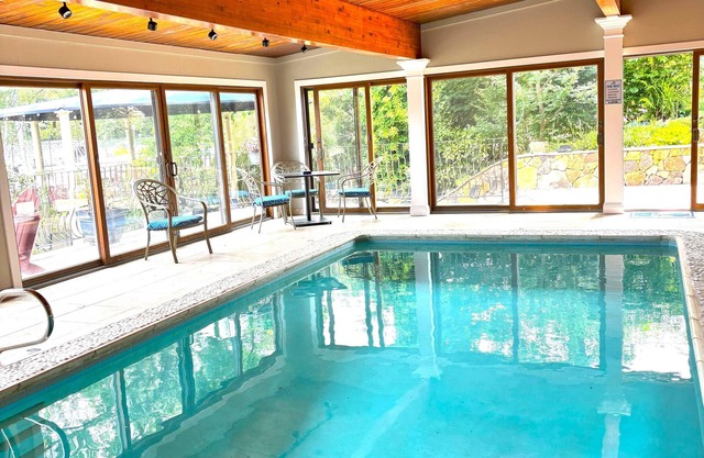 Indoor/Outdoor waterfront oasis with indoor heated pool awaits you in Eastport!