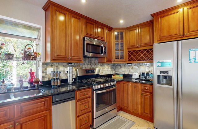 Inviting home with pool, fitness area, fireplace, & W/D