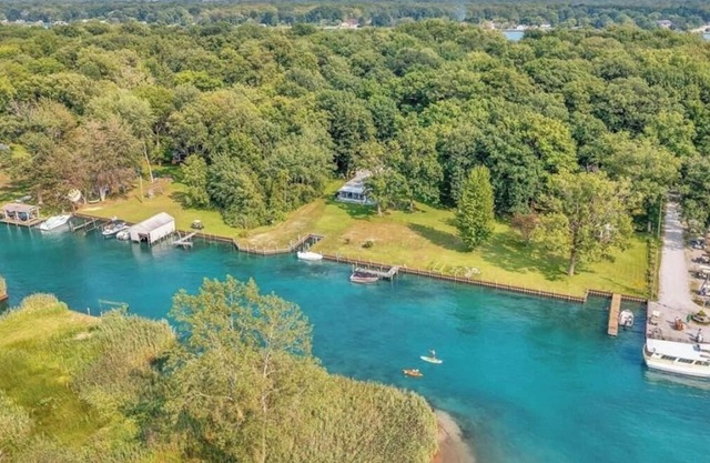 Island, house cottage. Lakefront property with boatlift and seawall.