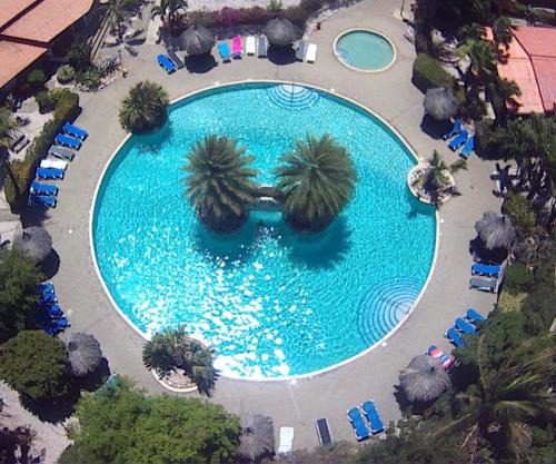 Kas di BaMi A-194 op Seru Coral Resort - Ruim appartement met groot zwembad en tropische tuin
