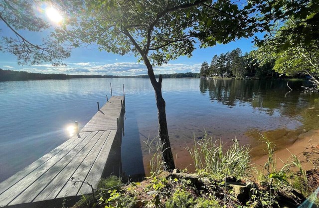 Located on a private peninsula with a SANDY beach on the Tiger Cat Flowage!