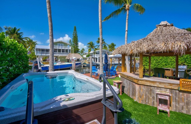 Key Largo Canalfront Home w/Boat Lift, Swim Spa, Tiki Hut & Game Room