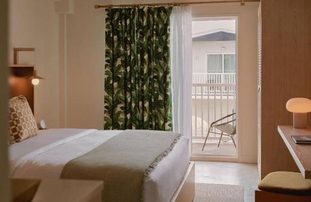 King Room w/Balcony Overlooking Courtyard Pool + Rooftop Bar