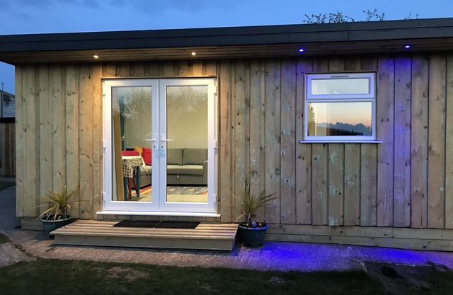 Kingfisher - our cosy, spacious glamping cabin at Mena Farm, Cornwall
