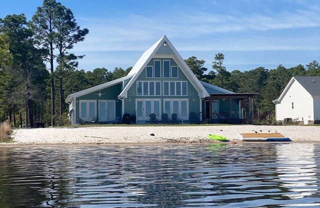 Lake front living with private sandy beach!