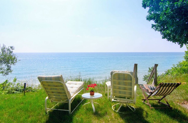Lake Michigan House in Woods - lake view behind main yellow house