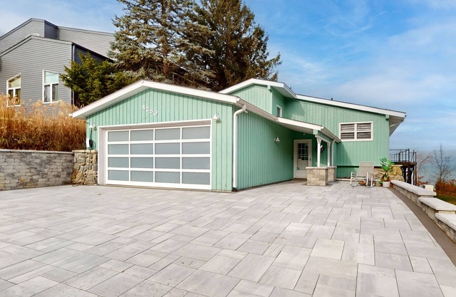 Lake Michigan Retreat w/ stunning views, beach access, hot tub, & large patio!