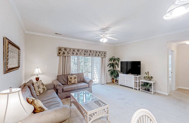 Lake-view ground-floor condo with screened patio, W/D, & pool