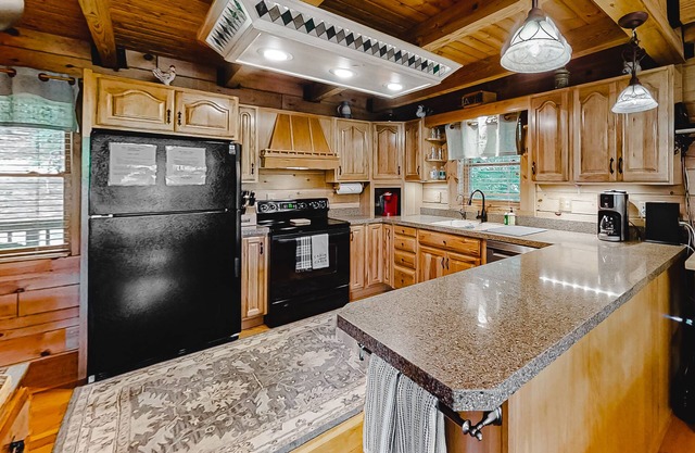 Lakefront cabin with private covered dock, lovely deck, lake view & fireplace