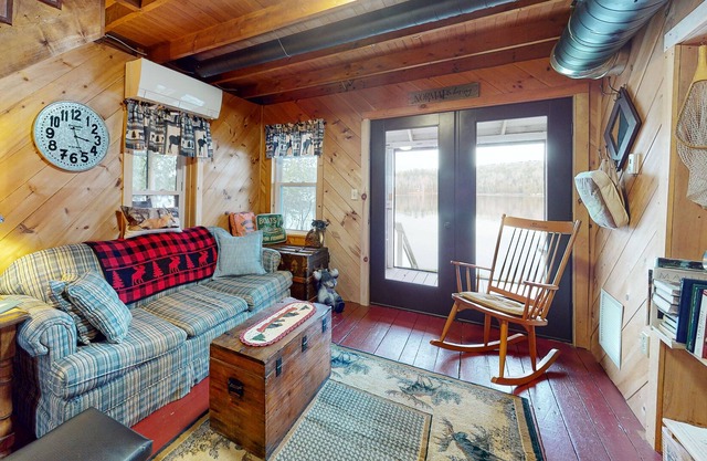 Lakefront cabin with screened porch, woodstove, & water access - dog-friendly