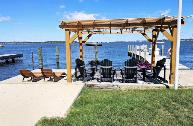 Lakefront cottage on Muskegon Lake! Fire pit, 40' BOAT DOCK, near beach, shops