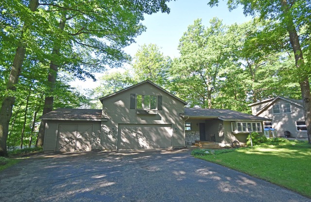 Lakefront home on Little Glen Lake with fireplace, deck, gas grill, and firepit
