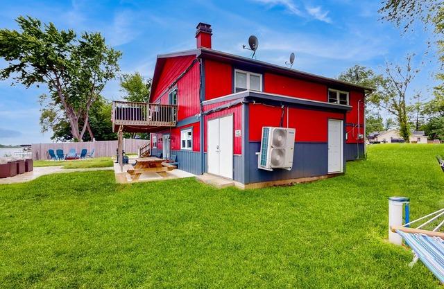 Dog-friendly lakefront home with water toys, firepit, 2 kitchens, & 2 W/Ds