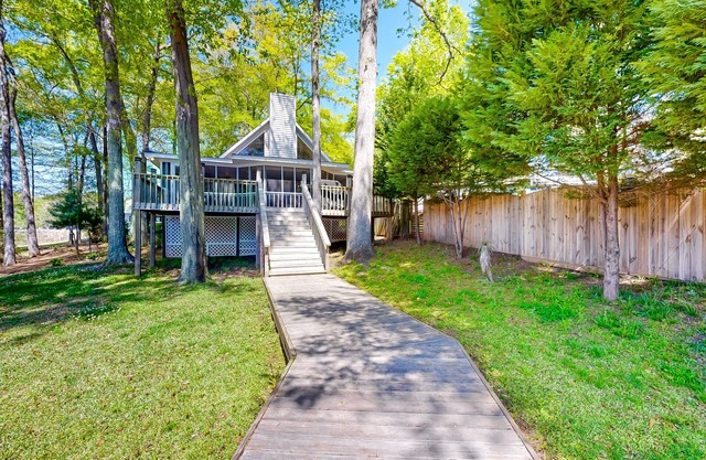 Lakefront home with two boat slips, lake views, firepit, grill, deck, & 2 kayaks