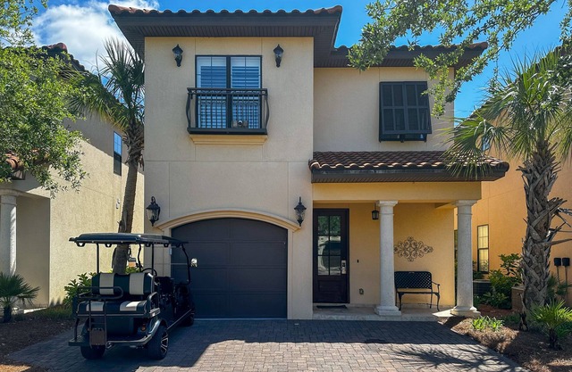 Lakefront Mediterranean-style home with pool, tennis & 6-seater golf cart