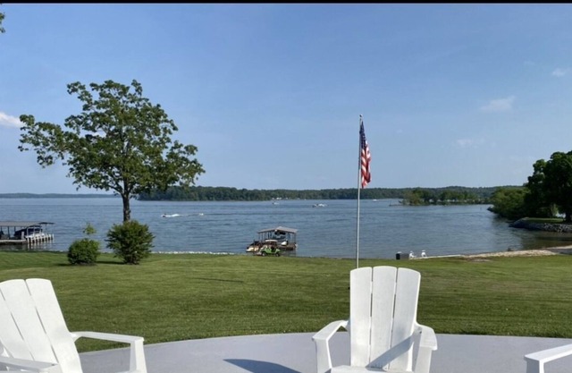Lakefront with gentle slope to waters edge with pebble beach.