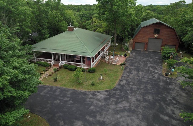Lakeside Ranchette with game room, wrap around porch, fire p