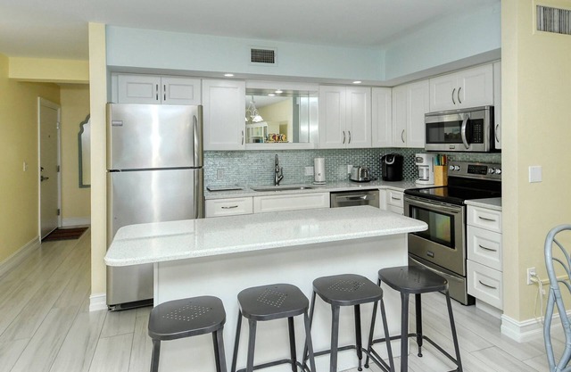 LaPlaya 103A-Time to relax! Enjoy the peaceful, private beach just a shell's throw from your door.