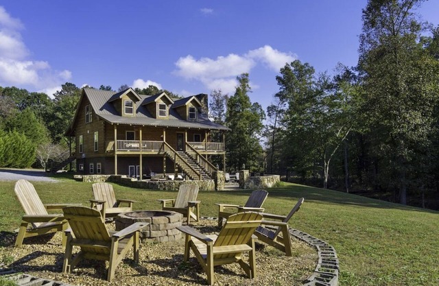 Large authentic 3-story log cabin adjacent to lake. Up to 10 guests.