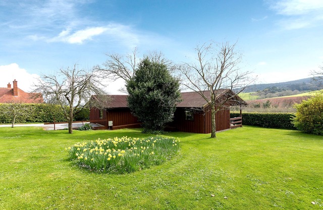 Grand Lodge sur 3 hectares avec une vue fabuleuse sur Exmoor, à 1,5 km à pied des boutiques et des pubs avec plage au-delà