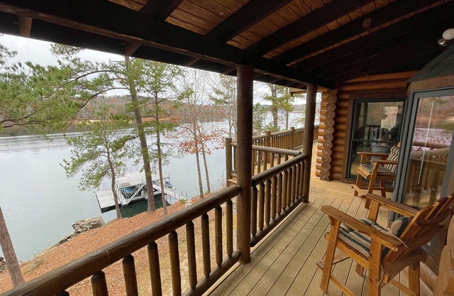 Large six-bedroom loghome w/ private boat ramp, dock, movie room and pool room.