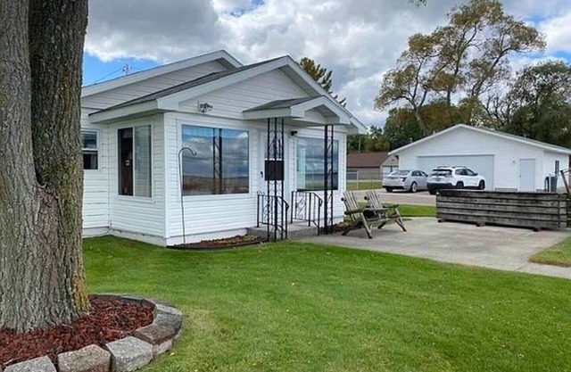 Life is Better at the Lake! Over 120 ft of frontage on Houghton Lake!