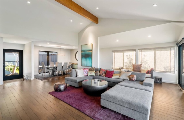 Live in luxury in this meticulously updated 3BR/3BA Claremont Heights mid-century modern home w/ AC.