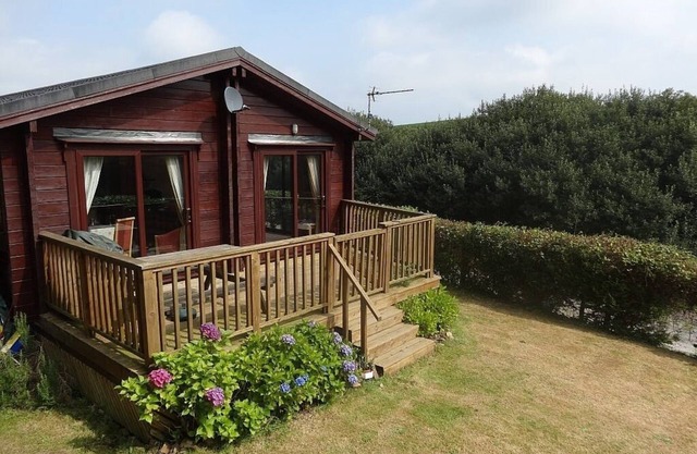 Lodge avec terrasse et jardin clos