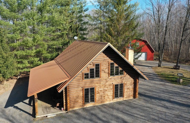 Log cabin secluded on 80 acres