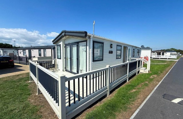 Lovely caravan with decking and WiFi at Suffolk Sands Holiday Park ref 45017B