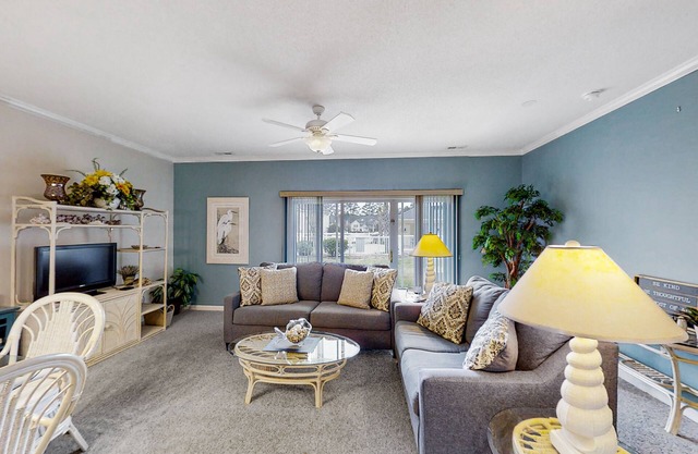 Lovely ground-floor golf-and-sea condo with on-site pool & screened patio