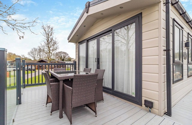 Lovely lodge set on a beautiful site with woodlands and fishing lakes.