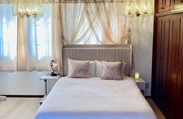 Luxrious double room with mountain view and ocean view from the balcony and an interior window / Hamada Shimane