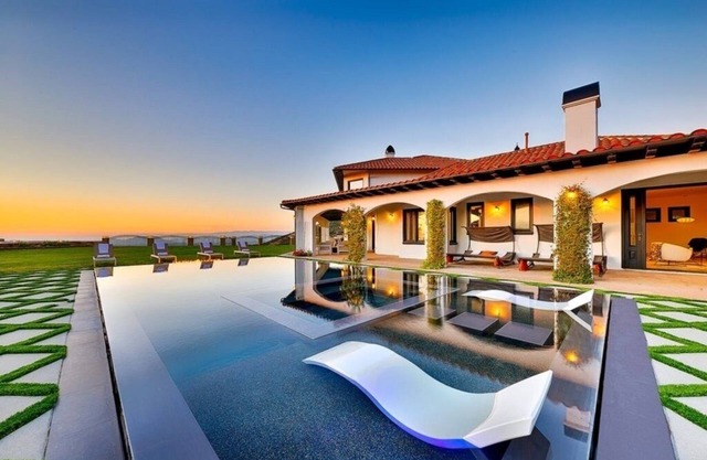 Luxurious 8-bedroom malibu Skyview estate With endless Stunning mountain views.