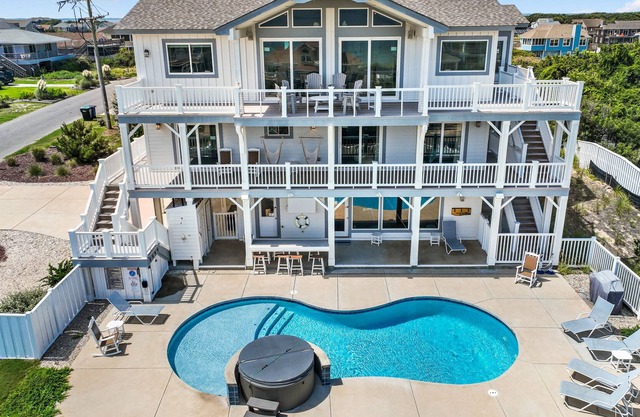 Luxurious home steps from beach with pool, hot tub, game room & fireplace