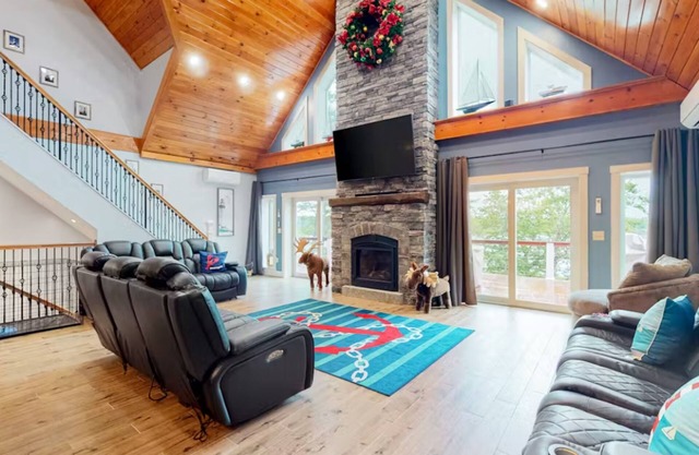 Luxurious waterfront home with deck, firepit, hot tub, fireplace, & pool table