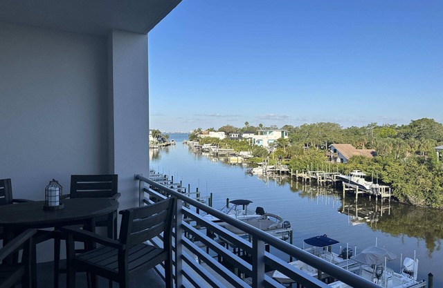 Luxury 2 Bed 2 Bath Waterfront Condo with Patio Sunsets Gym and Parking