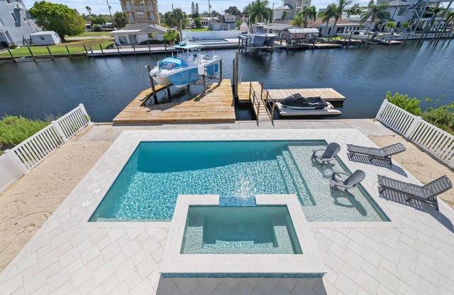 Luxury 3BR Waterfront Escape and Boaters Dream w/ Heated Pool, Jacuzzi & Private Dock – Gulf Access!