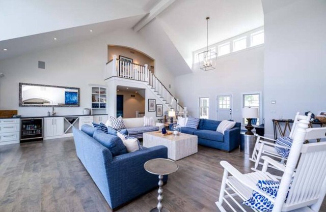 Luxury lakefront home w/ heated saltwater pool, cabana at top of beach stairs