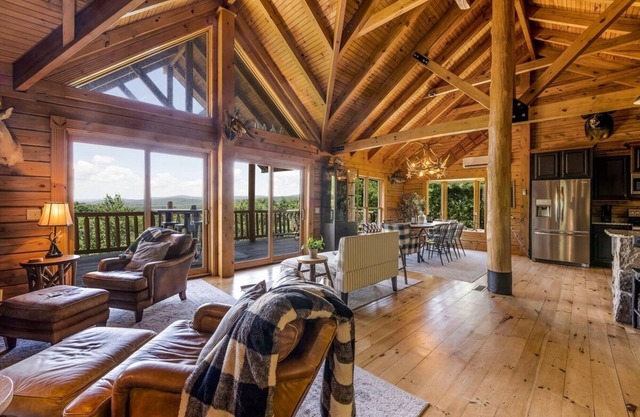 Unwind in this cozy log cabin surrounded by fresh mountain air and blooming forest views
