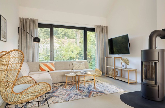 Luxury loft apartment with rooftop terrace and fireplace.