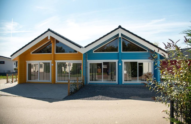 Luxury semi-detached chalets near the water.