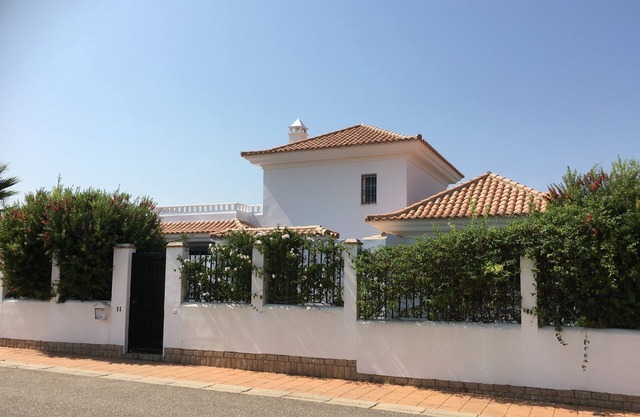 Luxury villa with own pool overlooking golf course, close to beach