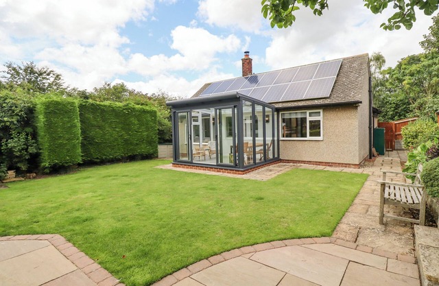 MANOR COTTAGE, pet friendly, with open fire in Embleton