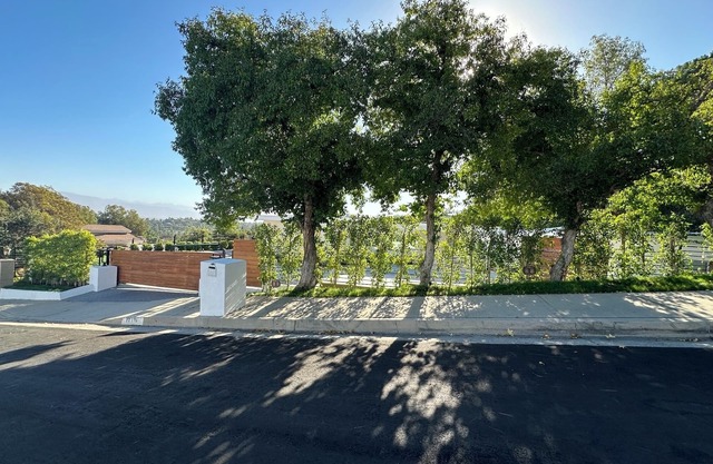 Mid-century modern pool estate with jetliner views in luxury celebrity hills