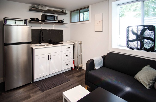 Modern 1 bed basement unit for traveling professionals with garage and laundry