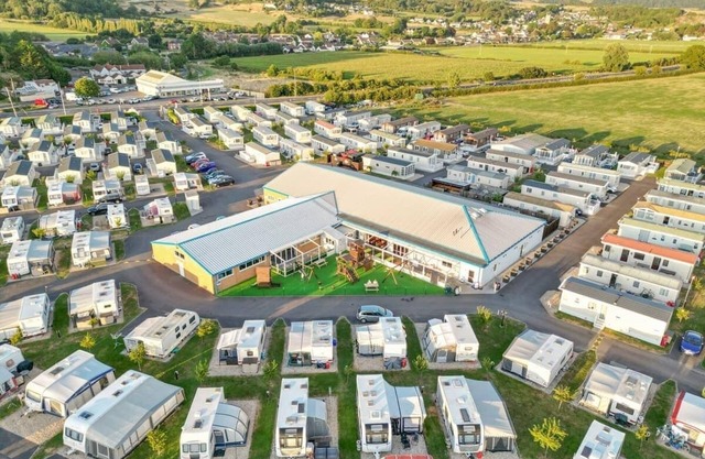Modern and contemporary 12ft-wide caravan with one double and two twin.
