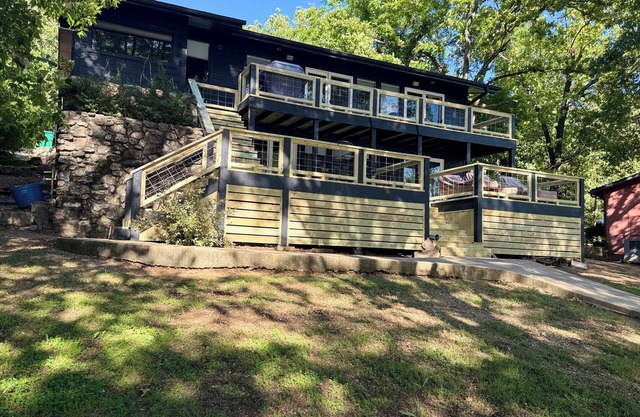 Modern, clean, lakefront home with two patios, fire pit, grill and so much more.